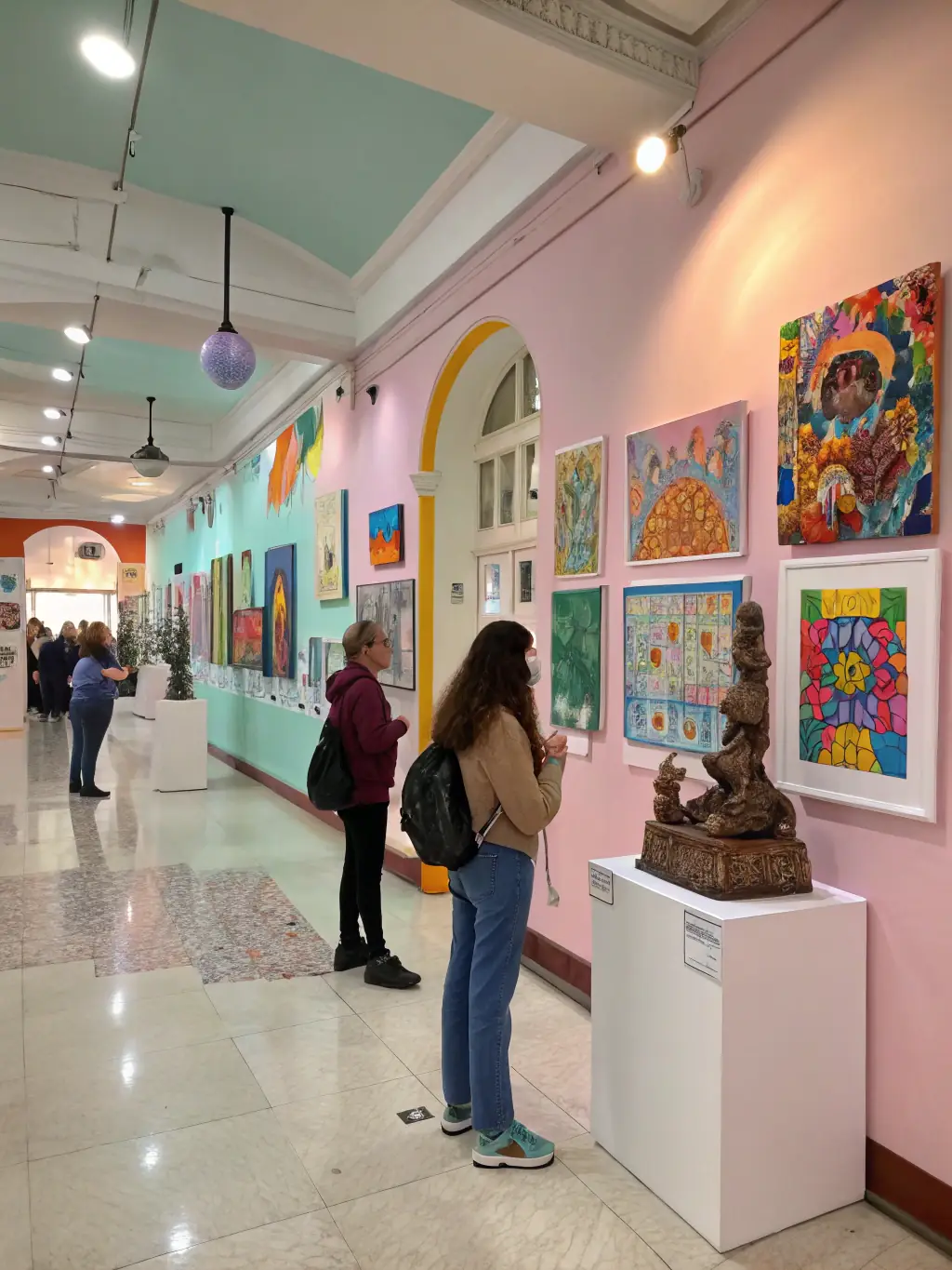 A captivating image of the Youth Talent Showcase, featuring young artists displaying their work in a gallery setting, emphasizing the organization's commitment to nurturing emerging talent.